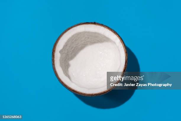 half a coconut - coconut isolated stock-fotos und bilder