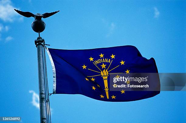 state flag waving in the wind - indiana flag stock pictures, royalty-free photos & images