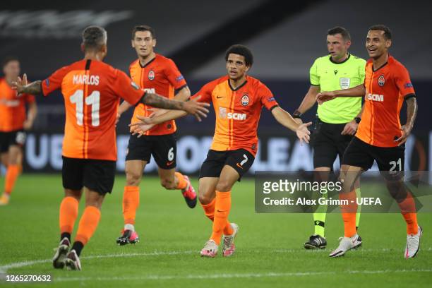 Taison of Shakhtar Donetsk celebrates with teammates after scoring his sides second goal during the UEFA Europa League Quarter Final between Shakhtar...