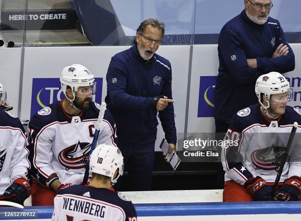 Head coach John Tortorella of the Columbus Blue Jackets handles bench duties during the second period against the Tampa Bay Lightning in Game One of...