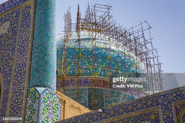 Shah Mosque facade with scaffolding. Naghsh-e Jahan Square. Isfahan, Iran. Asia.