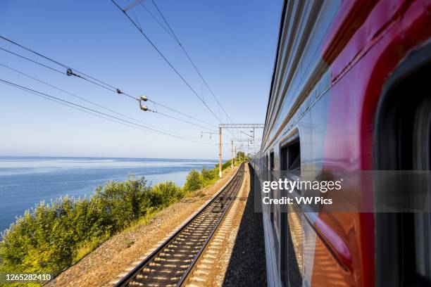 Bordering Lake Baikal with the Trans-Siberian train between Irkutsk and Ulan-Ude.