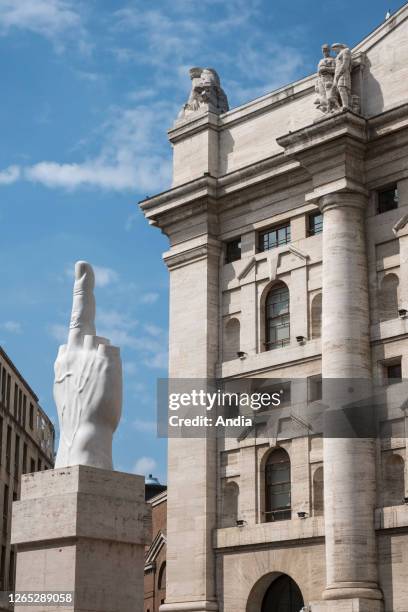 The sculpture L.O.V.E facing the Palazzo Mezzanotte, Milans Stock Exchange, in Piazza Affari . A work by sculptor Maurizio Cattelan depicting a hand...