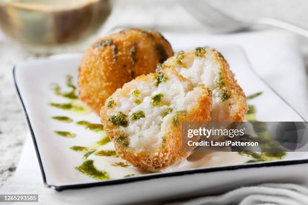 creamy 3 cheese arancini with garlic aioli and basil oil - stuffed stock pictures, royalty-free photos & images
