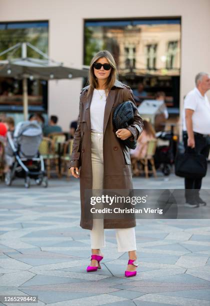 Darja Barannik is seen wearing brown coat, black bag outside Rains during Copenhagen Fashion Week Spring/Summer 2021 on August 11, 2020 in...