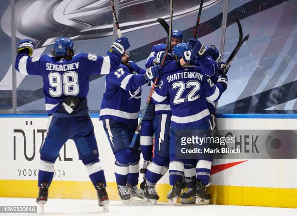 The Tampa Bay Lightning celebrate after Brayden Point scored the game winning goal at 10:27 in the fifth overtime to win 3-2 in Game One of the...