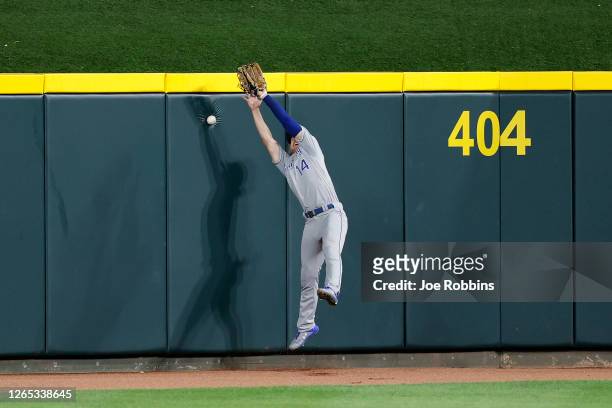Brett Phillips of the Kansas City Royals tries but is unable to catch the game-winning hit by Joey Votto of the Cincinnati Reds off the centerfield...