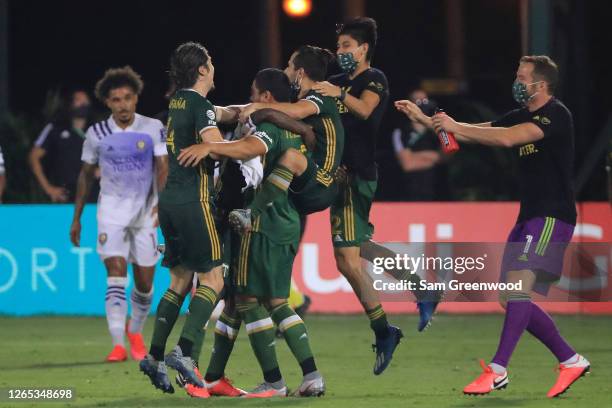 Sebastian Blanco of Portland Timbers and teammates celebrate after defeating Orlando City 2-1 in the final match of MLS Is Back Tournament at ESPN...