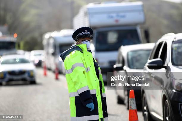 Queues stretch for kilometers in and out of Auckland as police stop vehicles at a checkpoint on SH1 north of Wellsford on August 12, 2020 in...