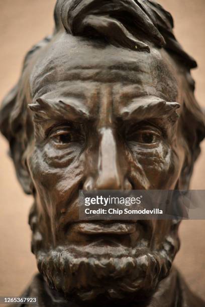 Bust of President Abraham Lincoln is part of the Gettysburg Address Memorial near the gate of the Soldiers' National Cemetery, across the road from...