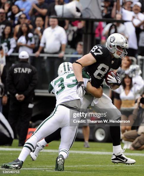Kevin Boss Kevin Boss of the Oakland Raiders is wrapped up after a seventeen ...