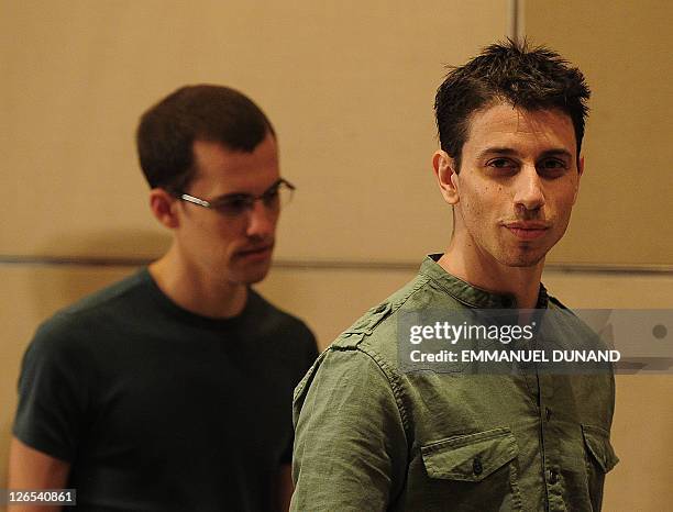 Shane Bauer and Josh Fattal , two US hikers held by Iran for more than two years on spying charges, arrive at a press conference after arriving back...