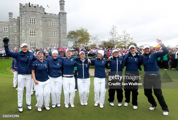 The European team celebrate victory on the 18th green following the singles matches on day three of the 2011 Solheim Cup at Killeen Castle Golf Club...