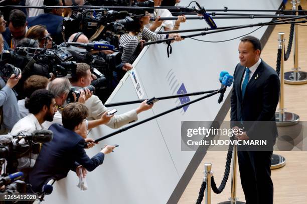 Ireland's Prime Minister Leo Varadkar talks to the media as he arrives for a European Council Summit, at the EU headquarters in Brussels, on June 29,...