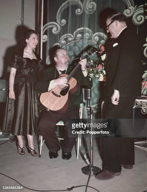 From left, actress and television presenter Sylvia Peters , American singer and actor Burl Ives and Imlay Newbiggin Watts of the BBC Special Projects...
