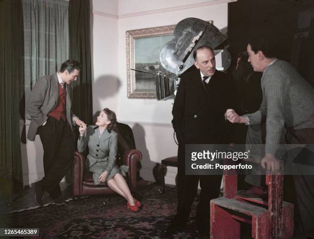 From left, actors Terence Morgan and Phyllis Calvert , producer Michael Balcon and director Alexander Mackendrick on the set of the British film...