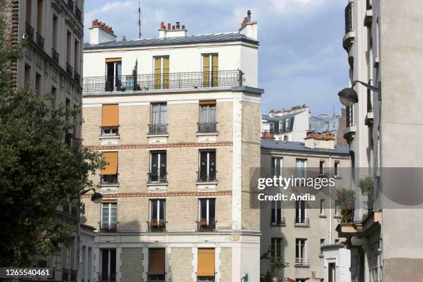 Facade of buildings in the street rue du Transvaal" near the Belleville Park, in the 20th arrondissement .