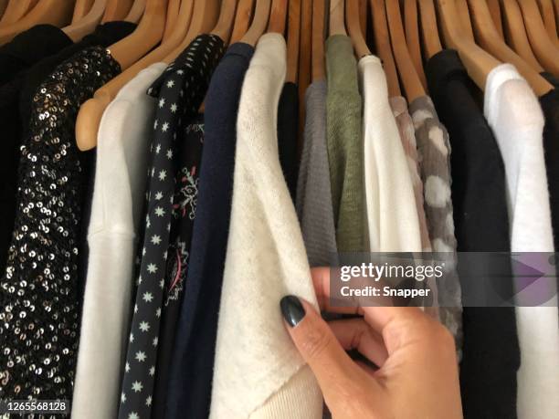 woman choosing what to wear - clothes wardrobe stockfoto's en -beelden
