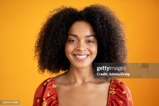 headshot portrait of cheerful young mixed race woman in summer top - medium length hair stock pictures, royalty-free photos & images