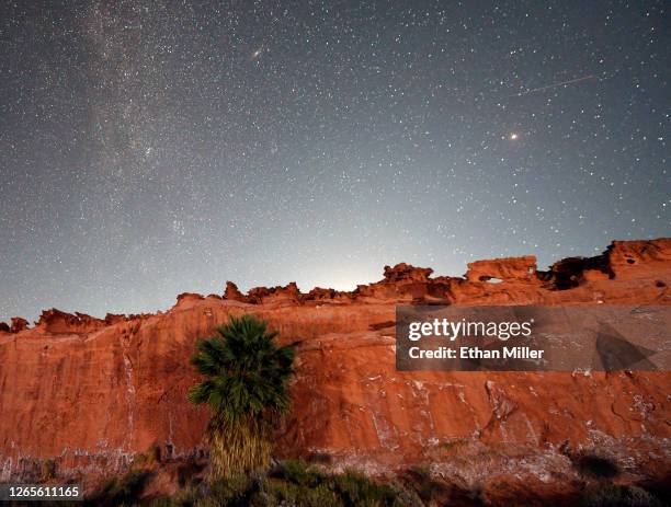 Perseid meteor streaks across the sky over the planet Mars above the red sandstone area known as Little Finland, about 110 miles northeast of Las...