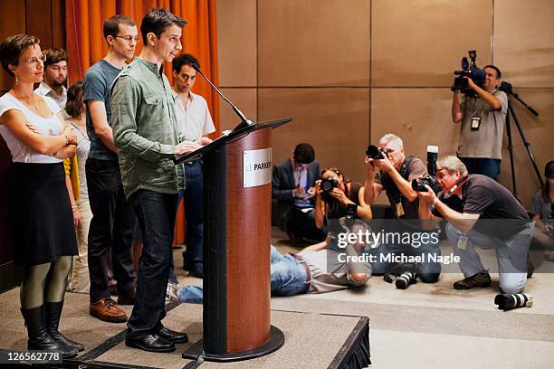 Sarah Shourd and Josh Fattal stand behind Shane Bauer as he speaks at press conference at the Parker Meridien New York, after Bauer and Fattal's...