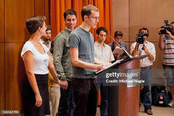 Sarah Shourd holds Josh Fattal's hand , as Shane Bauer speaks at press conference at the Parker Meridien New York, after Bauer and Fattal's release...