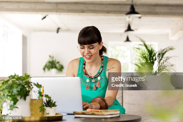 young woman working in the eco-friendly green office - copy writing stock pictures, royalty-free photos & images