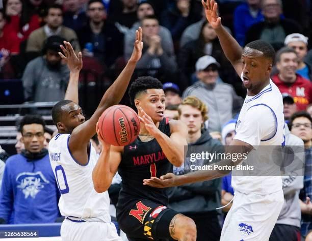 Anthony Cowan Jr. #1 of the Maryland Terrapins passes the balll against the Seton Hall Pirates at Prudential Center on December 19, 2019 in Newark,...