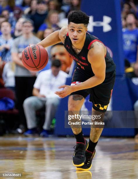 Anthony Cowan Jr. #1 of the Maryland Terrapins dribbles the balll against the Seton Hall Pirates at Prudential Center on December 19, 2019 in Newark,...