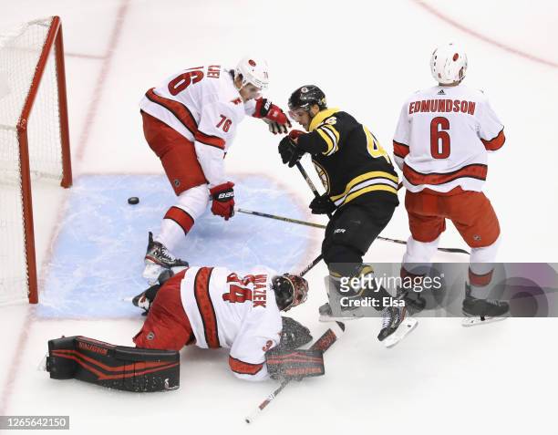 David Krejci of the Boston Bruins celebrates his goal at 57 seconds of the third period against Petr Mrazek of the Carolina Hurricanes in Game One of...