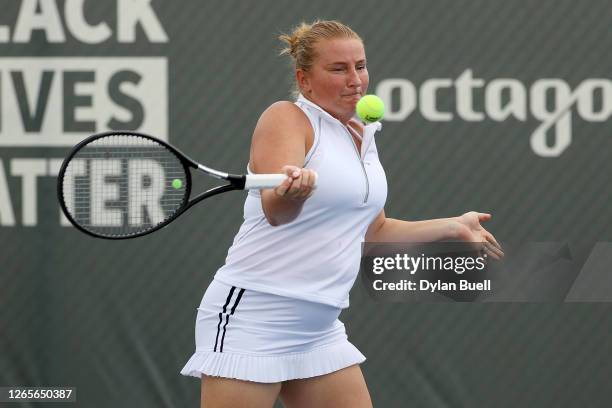 Alla Kudryavtseva of Russia plays a forehand during her doubles match with Oksana Kalashnikova of Georgia against Desirae Krawczyk and Alexa Guarachi...