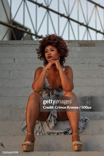 portrait of young black woman sitting on steps, barranquilla, colombia - barranquilla colombia stock pictures, royalty-free photos & images