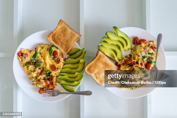 directly above shot of food in plate on table - stuffed avocado stock pictures, royalty-free photos & images