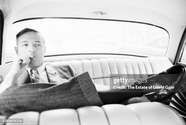 American public intellectual, commentator, and author William Frank Buckley, Jr. Reviews a speech as he is being driven in a towncar to an appearance...