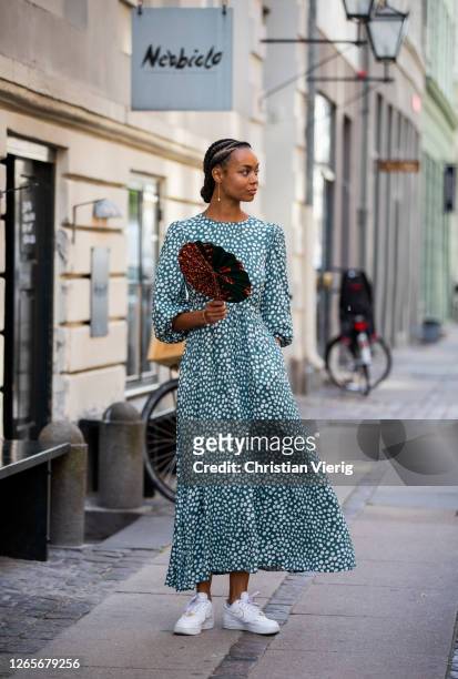 Guest is seen wearing dress with dots print outside Skall Studio during Copenhagen Fashion Week Spring/Summer 2021 on August 12, 2020 in Copenhagen,...
