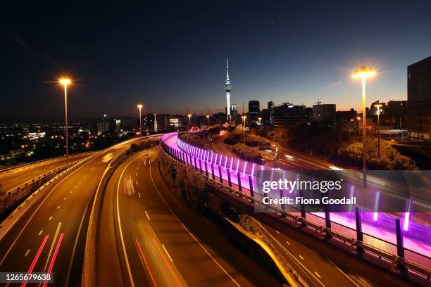 The sun rises over a very quiet Auckland motorway on the first full day of a return to level three lockdown on August 13, 2020 in Auckland, New...