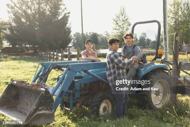 portrait of farmer and his two sons - filipino farmer fotografías e imágenes de stock