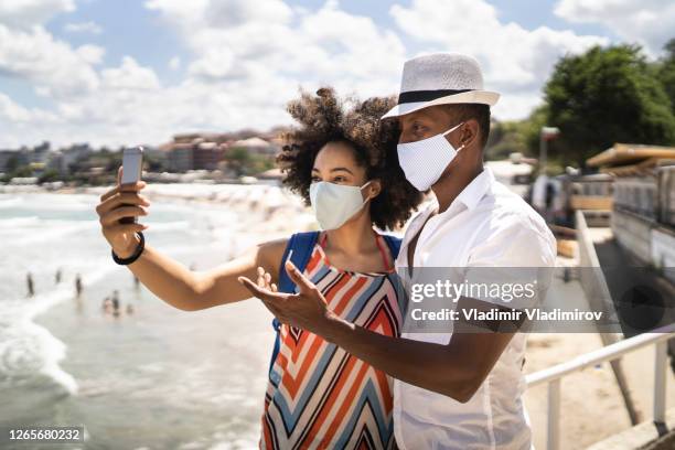 taking a selfie in time of new vacation's conditions - covid dating stock pictures, royalty-free photos & images