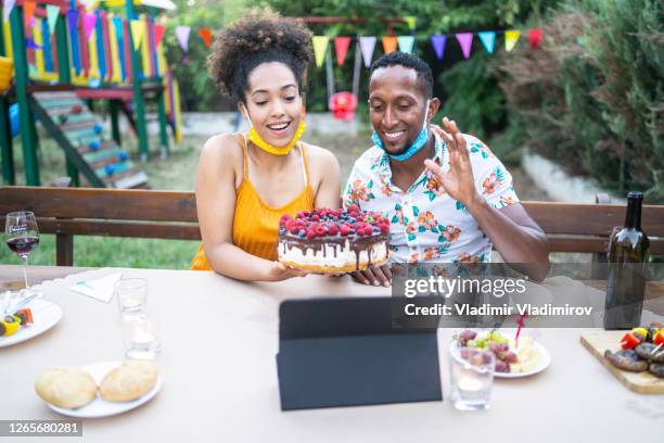 virtual birthday with friends in back yard in new conditions due to covid-19 pandemic - zoom birthday stock pictures, royalty-free photos & images