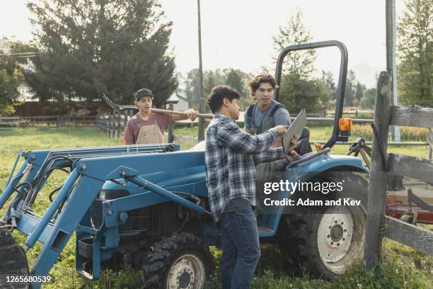 farmer and two sons talking - filipino farmer fotografías e imágenes de stock