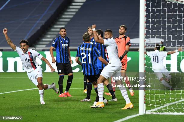 Marquinhos of Paris Saint-Germain celebrates after scoring his team's first goal during the UEFA Champions League Quarter Final match between...