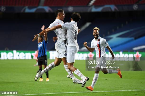 Marquinhos of Paris Saint-Germain celebrates after scoring his team's first goal during the UEFA Champions League Quarter Final match between...
