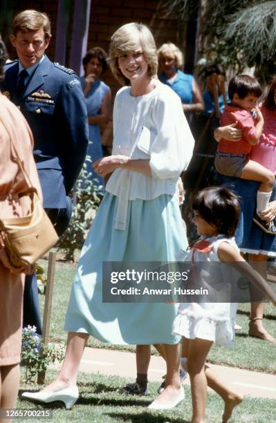 Diana, Princess of Wales, wearing a white blouse and pale green skirt designed by Benny Ong, visits Karguru School on March 22, 1983 in Northern...