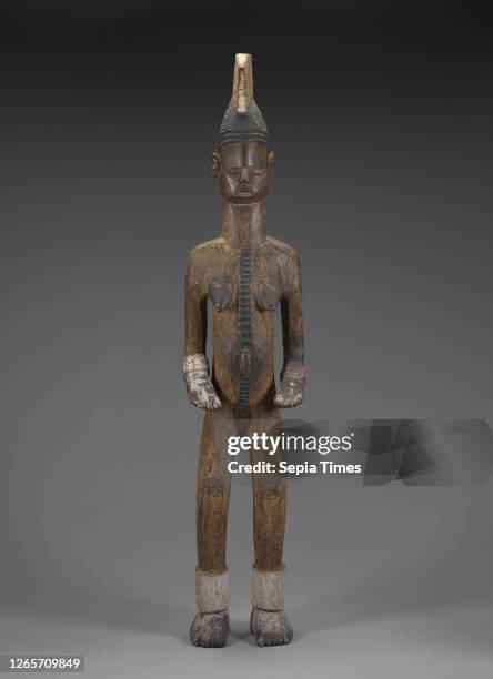 Female figure, Igbo people, wood, pigment, H: 52-1/4 in., African Art.