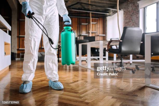 disinfecting office during corona virus pandemic - epidemic imagens e fotografias de stock