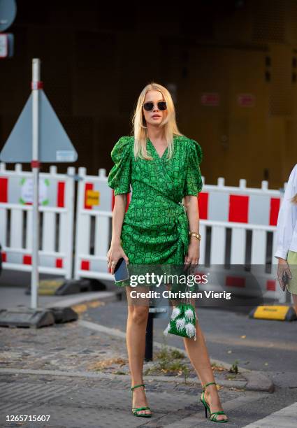 Guest is seen wearing green dress outside Henrik Vibskov during Copenhagen Fashion Week Spring/Summer 2021 on August 12, 2020 in Copenhagen, Denmark.