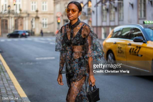 Guest is seen wearing sheer dress outside Saks Potts during Copenhagen Fashion Week Spring/Summer 2021 on August 12, 2020 in Copenhagen, Denmark.