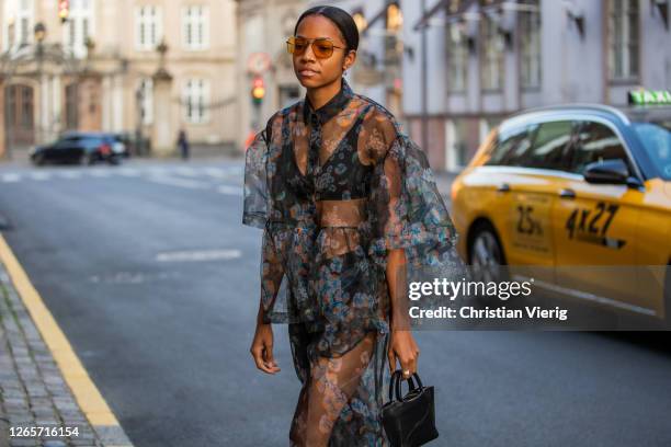 Guest is seen wearing sheer dress outside Saks Potts during Copenhagen Fashion Week Spring/Summer 2021 on August 12, 2020 in Copenhagen, Denmark.