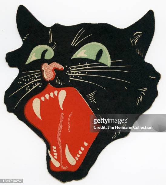 Die-cut Halloween decoration shows the disembodied head of a screaming black cat, circa 1935.