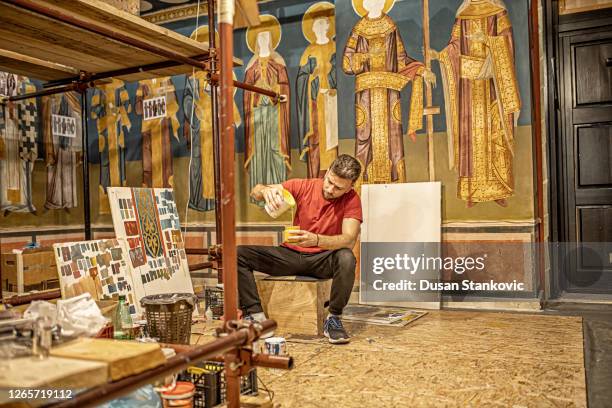 artist preparing tools to paint fresco in the church - religious icon stock pictures, royalty-free photos & images
